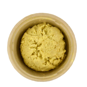 Scoop of pistachio ice cream in a bowl.