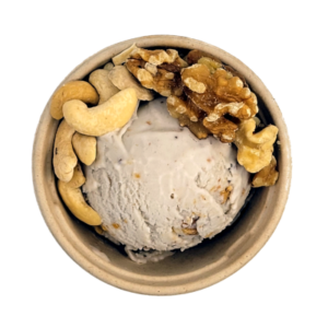 Scoop of banana walnut ice cream in a cup.